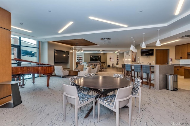 dining area featuring light carpet