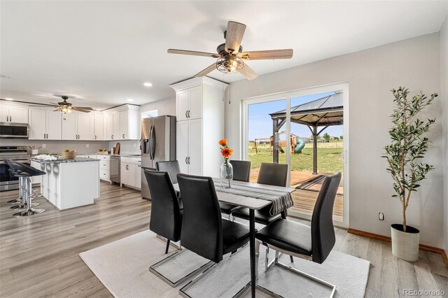 1134 Buffalo Run Rd, Calhan, CO 80808 - dining room with a ceiling fan, light wood finished floors, recessed lighting, and baseboards