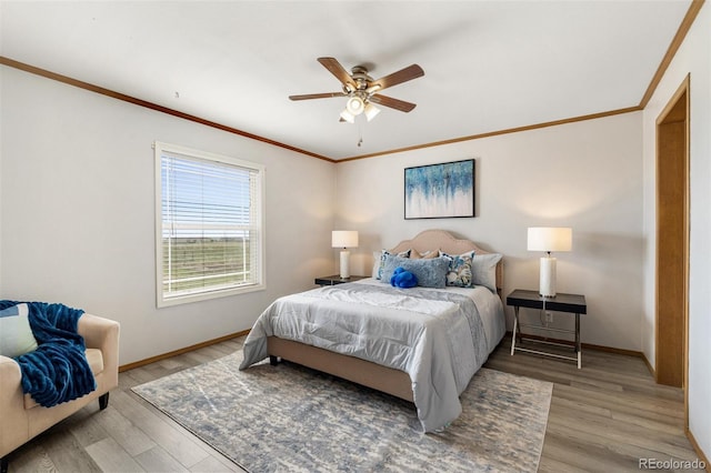1134 Buffalo Run Rd, Calhan, CO 80808 - bedroom featuring light wood finished floors, baseboards, ornamental molding, and ceiling fan