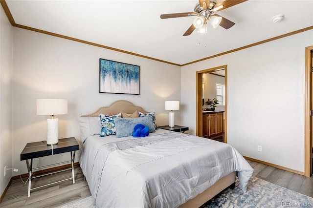 1134 Buffalo Run Rd, Calhan, CO 80808 - bedroom featuring crown molding, baseboards, light wood-style flooring, ceiling fan, and ensuite bathroom