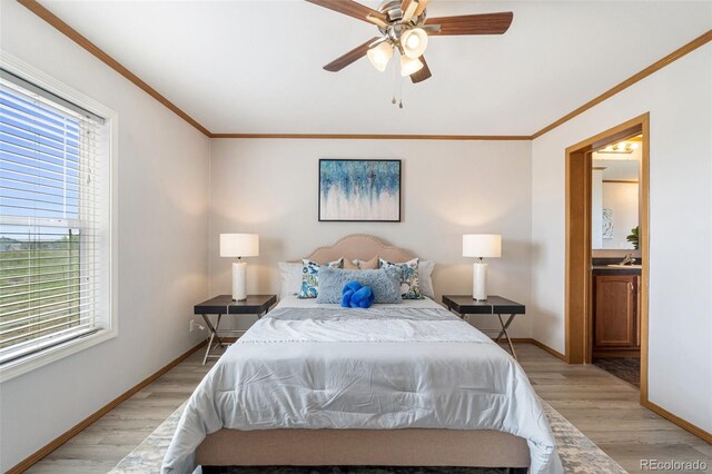 1134 Buffalo Run Rd, Calhan, CO 80808 - bedroom featuring light wood-style floors, baseboards, crown molding, ensuite bath, and a ceiling fan