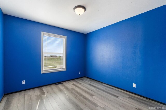 1134 Buffalo Run Rd, Calhan, CO 80808 - unfurnished room with wood finished floors and baseboards