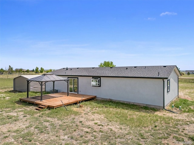 1134 Buffalo Run Rd, Calhan, CO 80808 - rear view of house with a deck and a gazebo