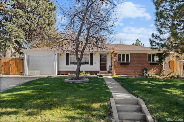 ranch-style home with a garage and a front lawn