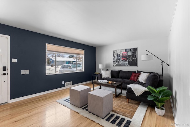 living room with light hardwood / wood-style flooring