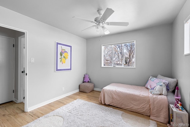 bedroom featuring ceiling fan and light hardwood / wood-style floors