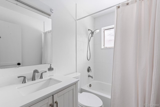 full bathroom with toilet, vanity, and shower / tub combo