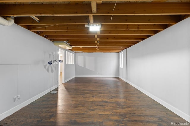 basement featuring dark wood-type flooring