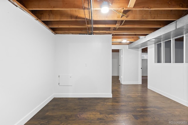 basement with dark wood-type flooring