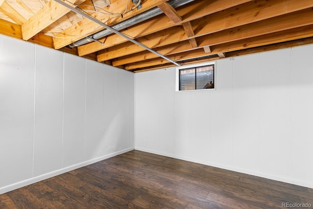 basement with dark wood-type flooring