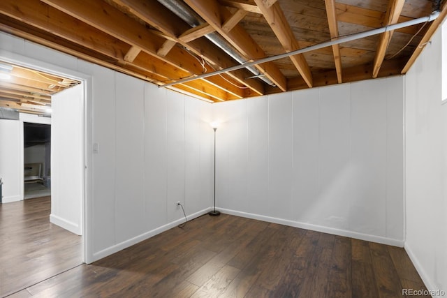 basement featuring dark wood-type flooring