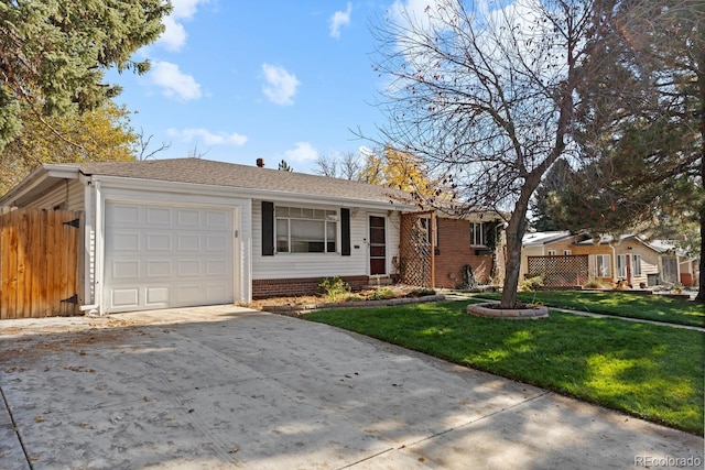 ranch-style house featuring a garage and a front yard