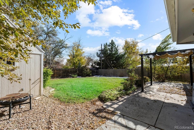 view of yard with a storage unit, a patio, and a pergola