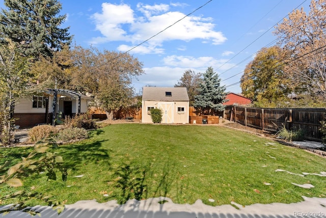 view of yard with a pergola and a shed