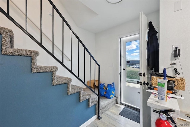 4058 Baytown Dr, Colorado Springs, CO 80916 - foyer featuring stairs and wood finished floors
