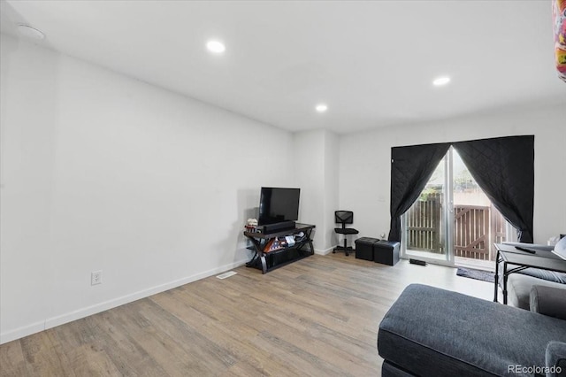 4058 Baytown Dr, Colorado Springs, CO 80916 - living room featuring wood finished floors, baseboards, and recessed lighting