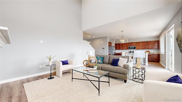 living room with light hardwood / wood-style flooring