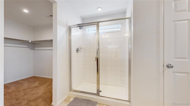 bathroom featuring an enclosed shower