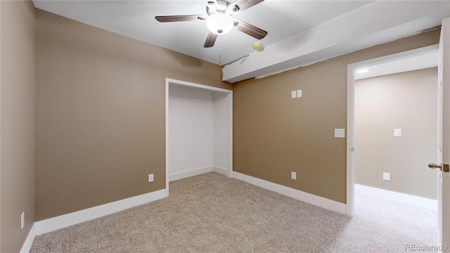 carpeted empty room with ceiling fan