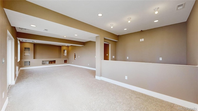 unfurnished living room featuring carpet floors