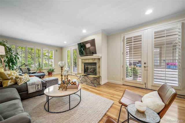 581 Garfield St, Denver, CO 80206 - living room with ornamental molding, wood finished floors, a fireplace, and recessed lighting