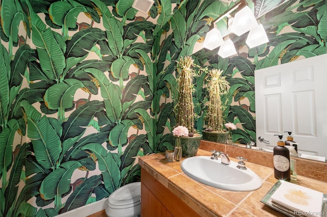 581 Garfield St, Denver, CO 80206 - bathroom featuring vanity and wallpapered walls
