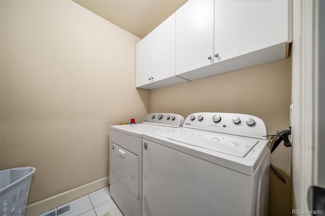 581 Garfield St, Denver, CO 80206 - laundry area with separate washer and dryer, cabinet space, and light tile patterned flooring