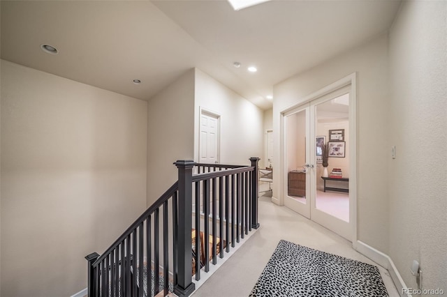 581 Garfield St, Denver, CO 80206 - corridor with an upstairs landing, recessed lighting, french doors, and light colored carpet