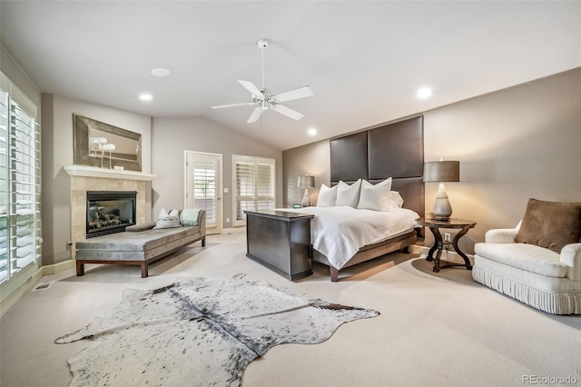 581 Garfield St, Denver, CO 80206 - bedroom featuring light colored carpet, lofted ceiling, a tiled fireplace, recessed lighting, and a ceiling fan