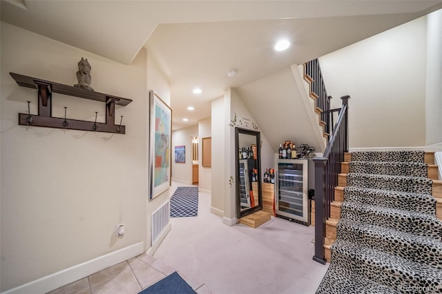 581 Garfield St, Denver, CO 80206 - stairway featuring wine cooler, a bar, recessed lighting, and carpet floors
