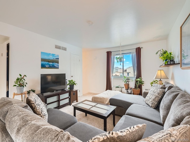 living room with carpet floors and visible vents