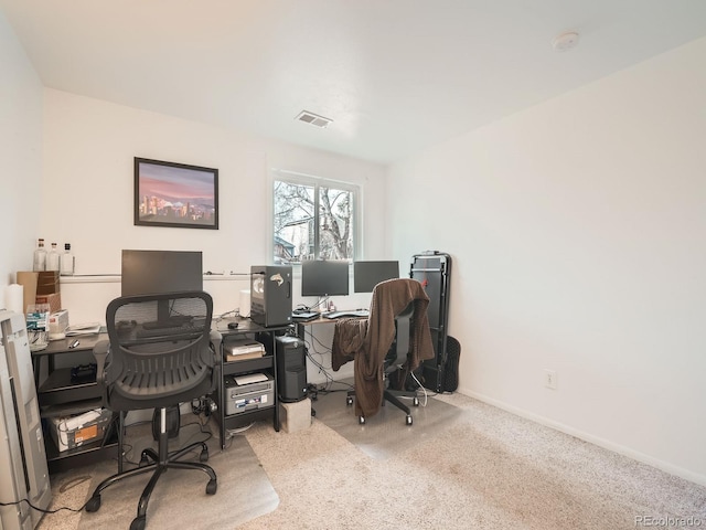 office featuring carpet flooring, visible vents, and baseboards