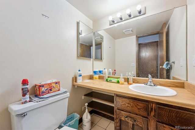 4855 S Joplin St, Aurora, CO 80015 - half bath with toilet, tile patterned floors, and vanity
