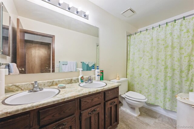 4855 S Joplin St, Aurora, CO 80015 - full bath with toilet, double vanity, and curtained shower