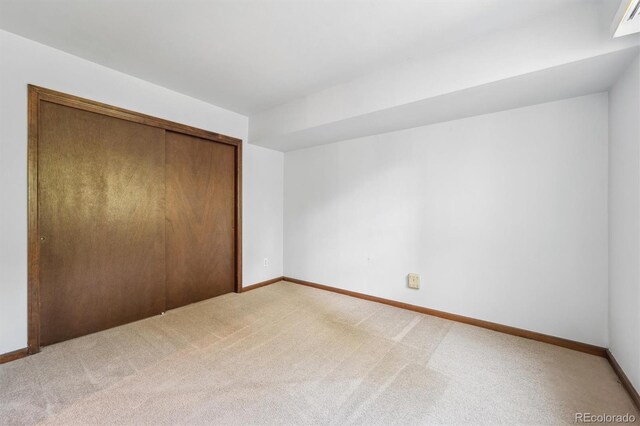 4855 S Joplin St, Aurora, CO 80015 - unfurnished bedroom with light carpet, a closet, and baseboards