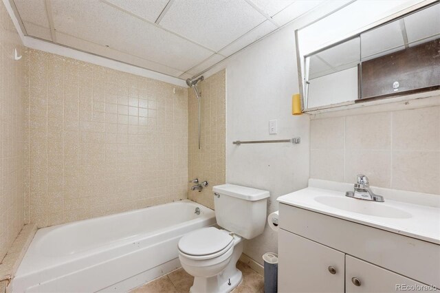 4855 S Joplin St, Aurora, CO 80015 - bathroom with toilet, bathing tub / shower combination, vanity, and tile patterned flooring