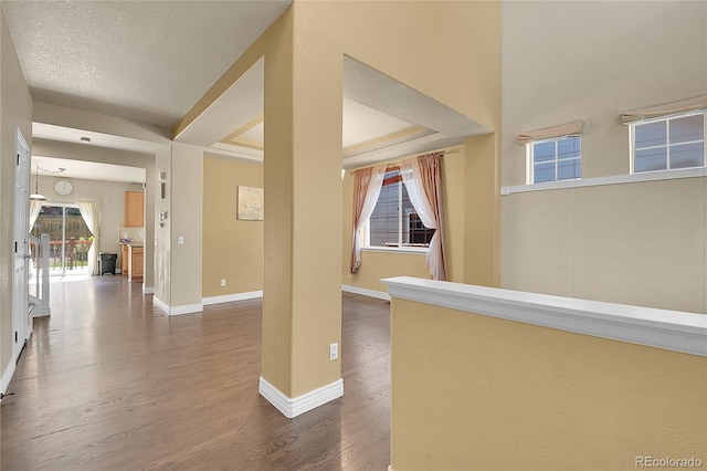 interior space with hardwood / wood-style floors and a textured ceiling