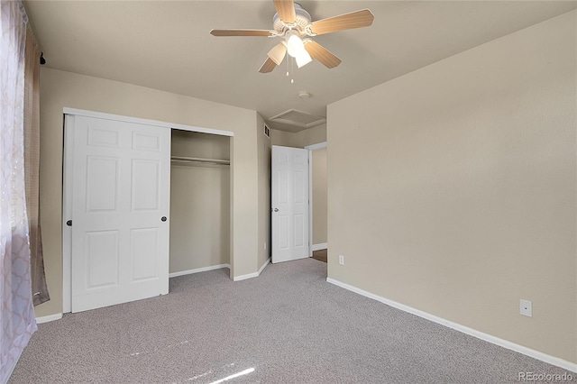 unfurnished bedroom featuring ceiling fan, light carpet, and a closet