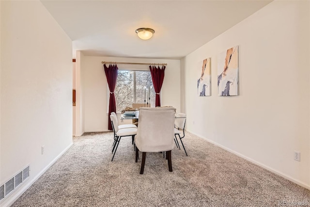 view of carpeted dining room