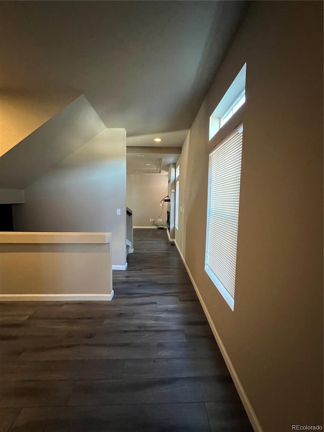 hall with dark wood-type flooring