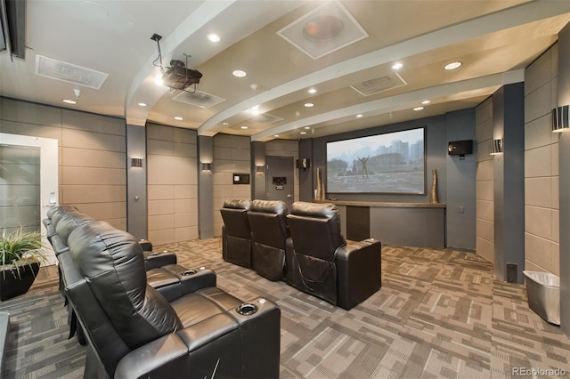 home theater with light colored carpet