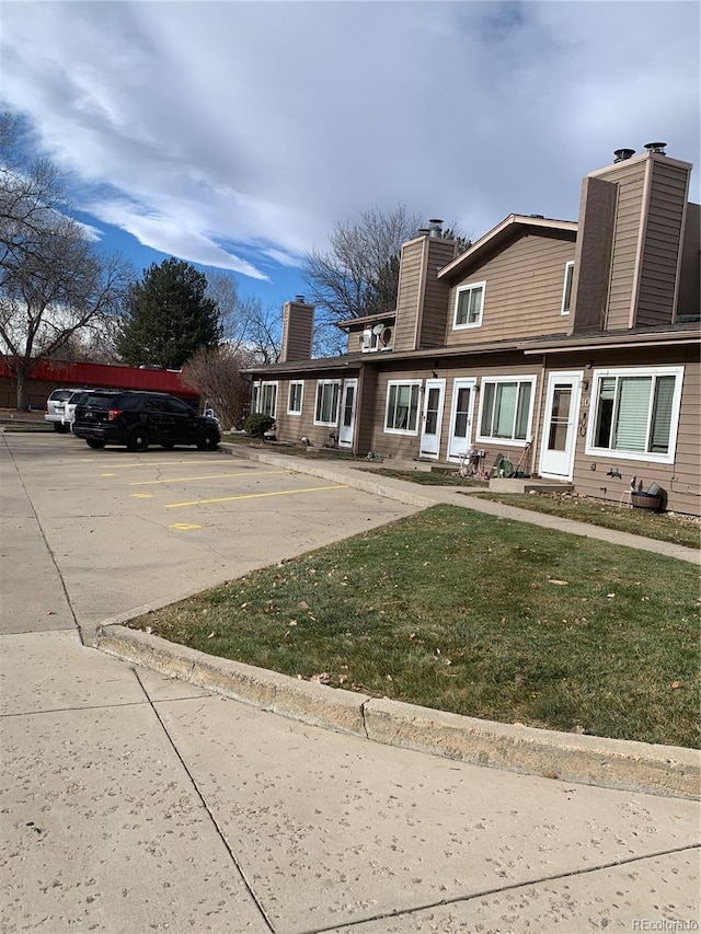 exterior space featuring a front lawn