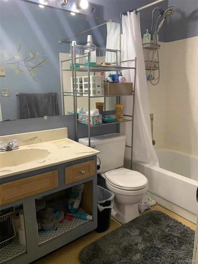 full bathroom featuring shower / bathtub combination with curtain, vanity, and toilet