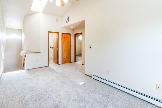 spare room with ceiling fan, a baseboard radiator, light colored carpet, and high vaulted ceiling