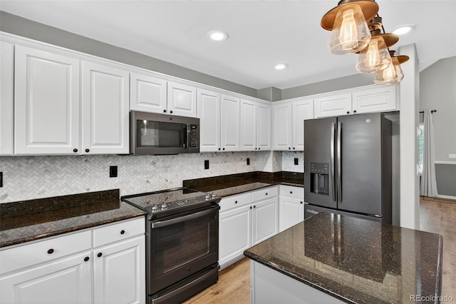4535 Hunterwood Dr, Highlands Ranch, CO 80130 - kitchen featuring appliances with stainless steel finishes, white cabinets, light wood-type flooring, backsplash, and dark stone countertops