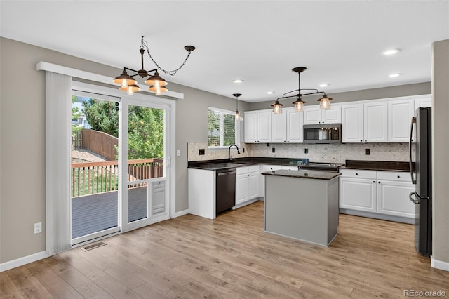 4535 Hunterwood Dr, Highlands Ranch, CO 80130 - kitchen featuring appliances with stainless steel finishes, a chandelier, dark countertops, white cabinets, and recessed lighting