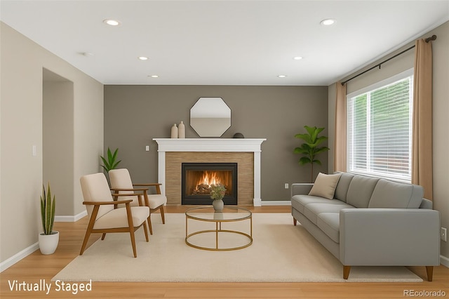 4535 Hunterwood Dr, Highlands Ranch, CO 80130 - living area featuring light wood finished floors, recessed lighting, and a tiled fireplace