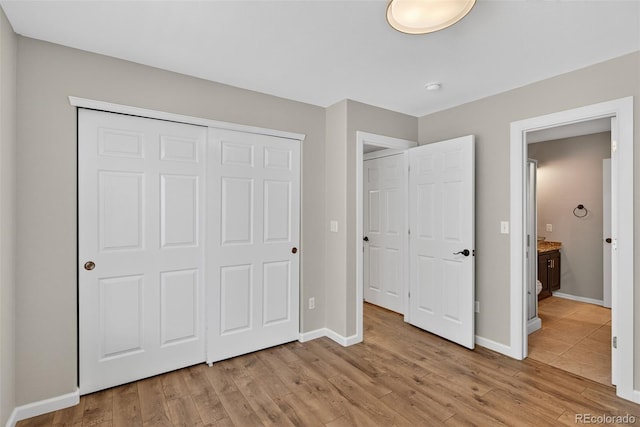 4535 Hunterwood Dr, Highlands Ranch, CO 80130 - unfurnished bedroom with light wood-style floors and a closet