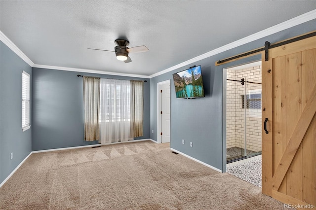 4535 Hunterwood Dr, Highlands Ranch, CO 80130 - carpeted spare room with crown molding, a ceiling fan, and a barn door