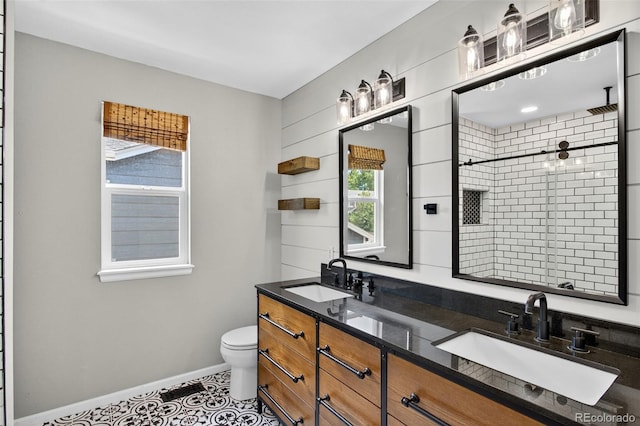 4535 Hunterwood Dr, Highlands Ranch, CO 80130 - full bath featuring tiled shower, double vanity, and tile patterned floors